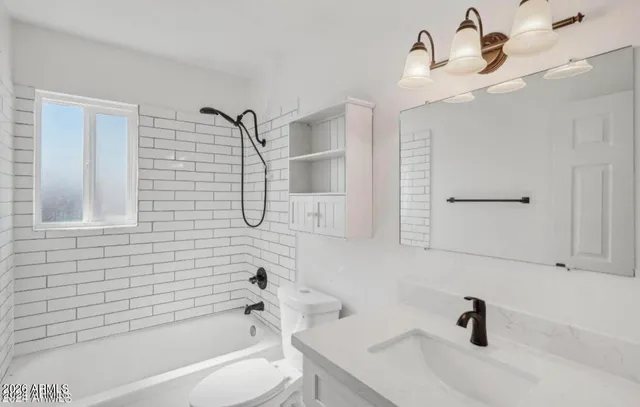a bathroom with a bathtub and a sink