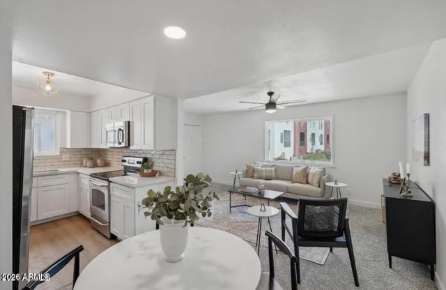 a kitchen with a table and chairs in it