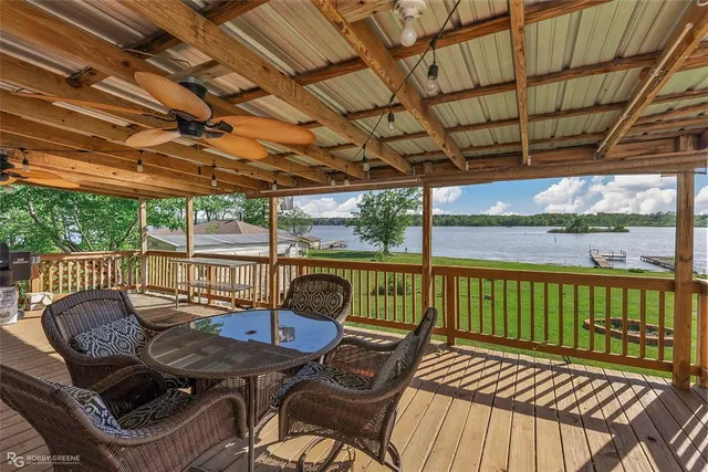 a view of a chairs in wooden deck