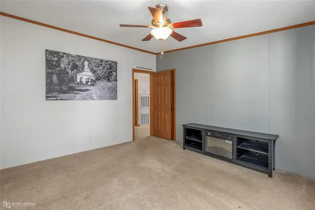 a view of workspace with furniture and a ceiling fan