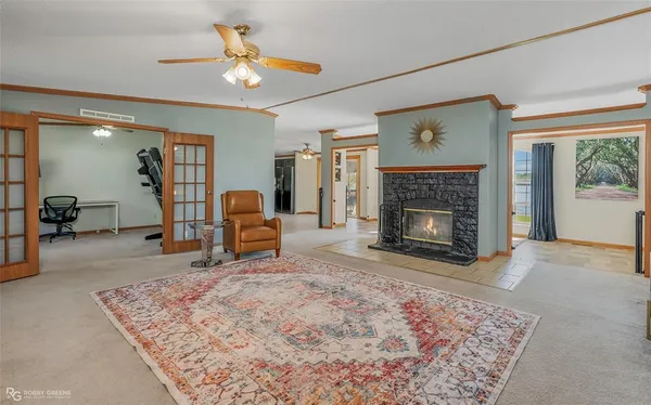 a living room with furniture and a fireplace
