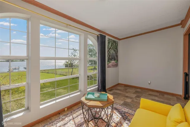 a living room with a couch and a large window