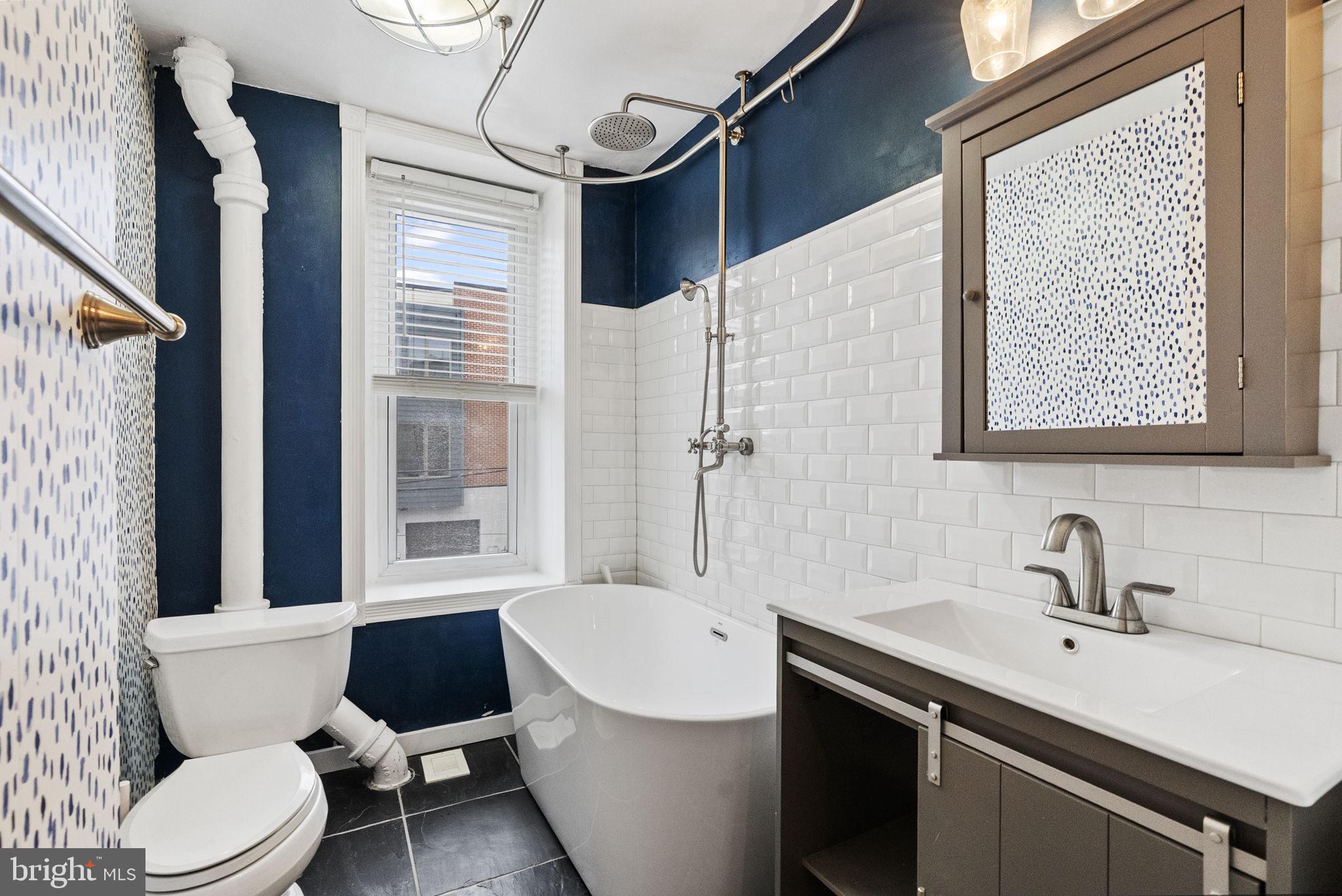 4349 Terrace Street Philadelphia, PA 19128 - Photo 15 of 25 a bathroom with a sink toilet a mirror and bathtub