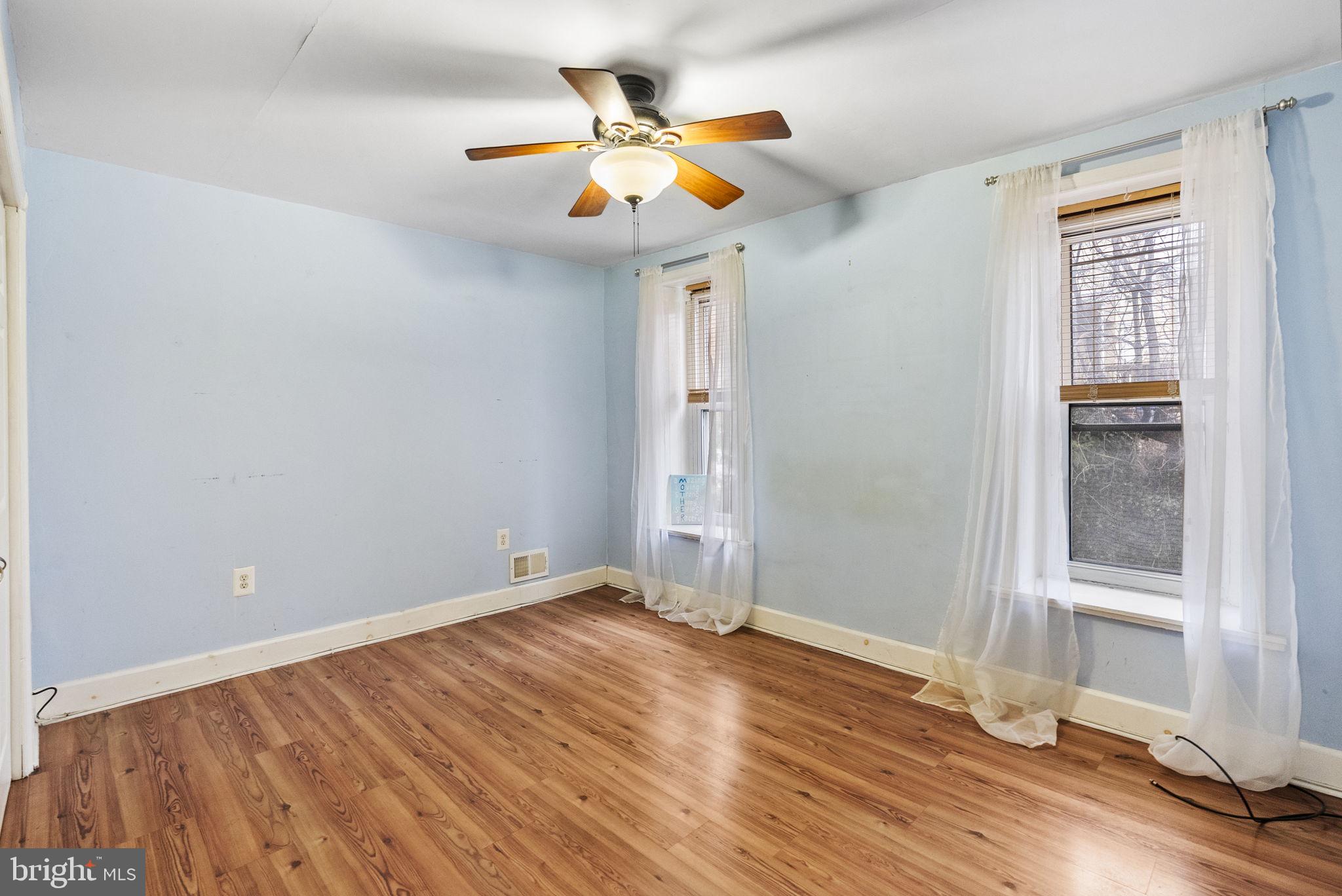4349 Terrace Street Philadelphia, PA 19128 - Photo 19 of 25 an empty room with wooden floor and windows