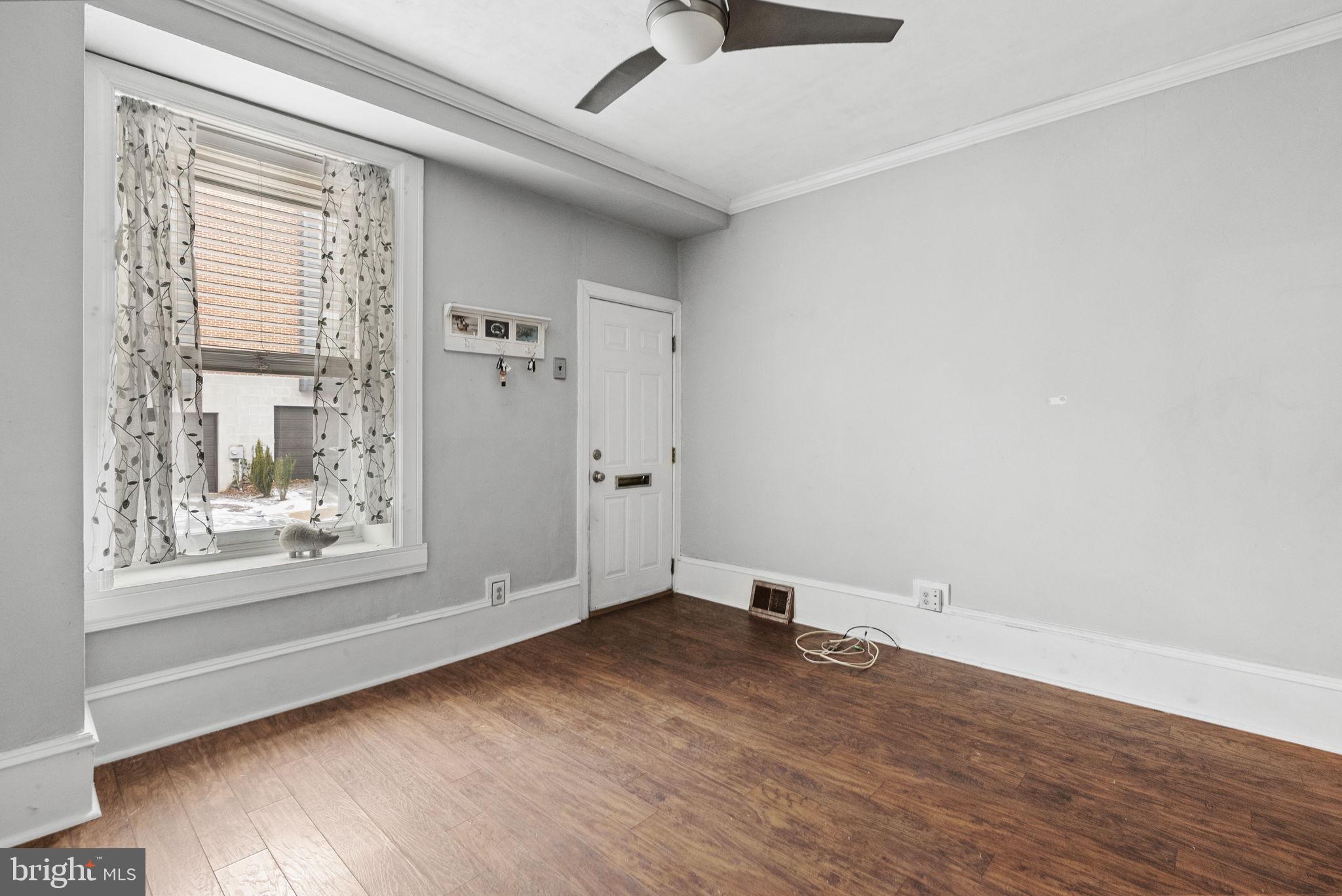 4349 Terrace Street Philadelphia, PA 19128 - Photo 6 of 25 an empty room with wooden floor and windows