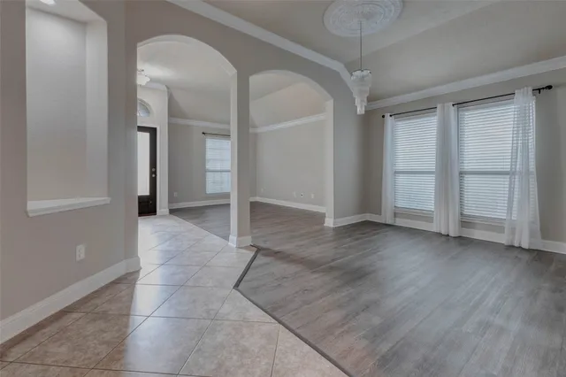 a view of a hallway with wooden shelves