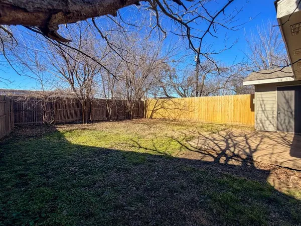 a view of yard with swimming pool