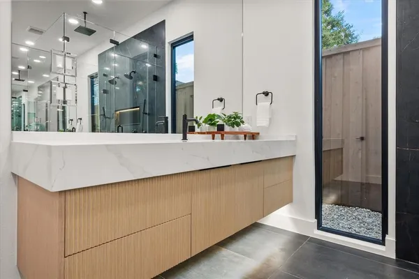 a bathroom with a sink and a mirror