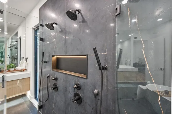 a view of a bathroom with a shower and a sink