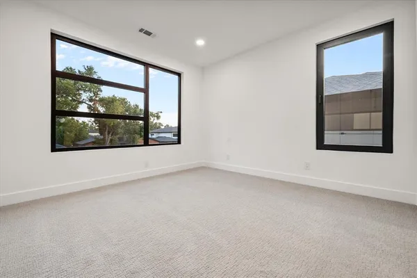 an empty room with large window