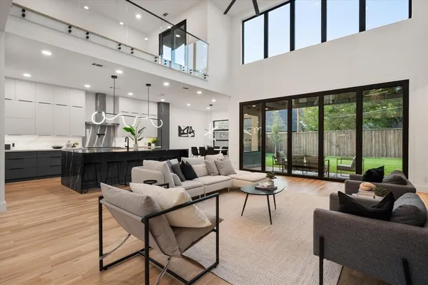 a living room with furniture and large windows