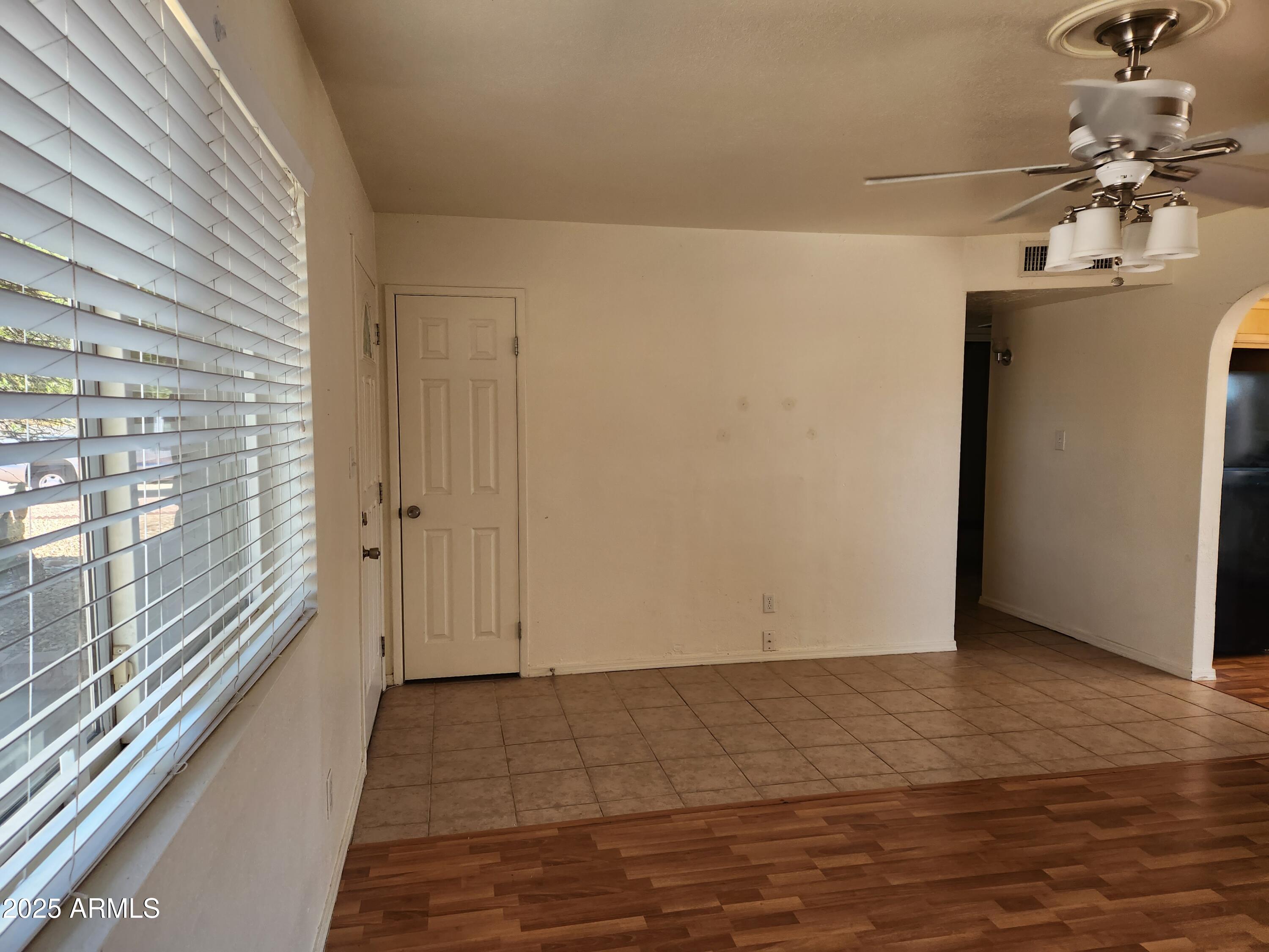 1803 West Kerry Lane Phoenix, AZ 85027 - Photo 6 of 11 a view of a hallway with a chandelier