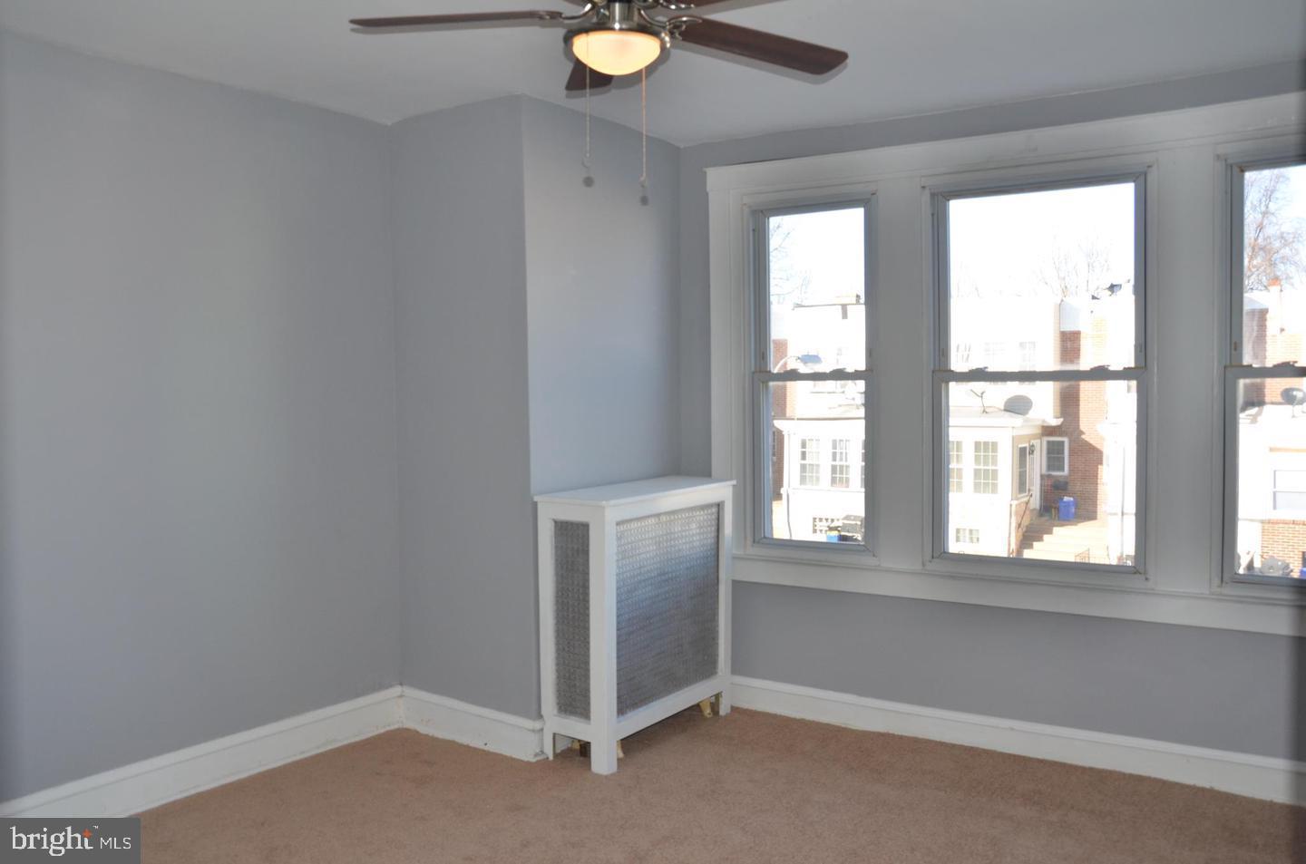 1758 South Avondale Street Philadelphia, PA 19142 - Photo 7 of 10 a view of an empty room with a window