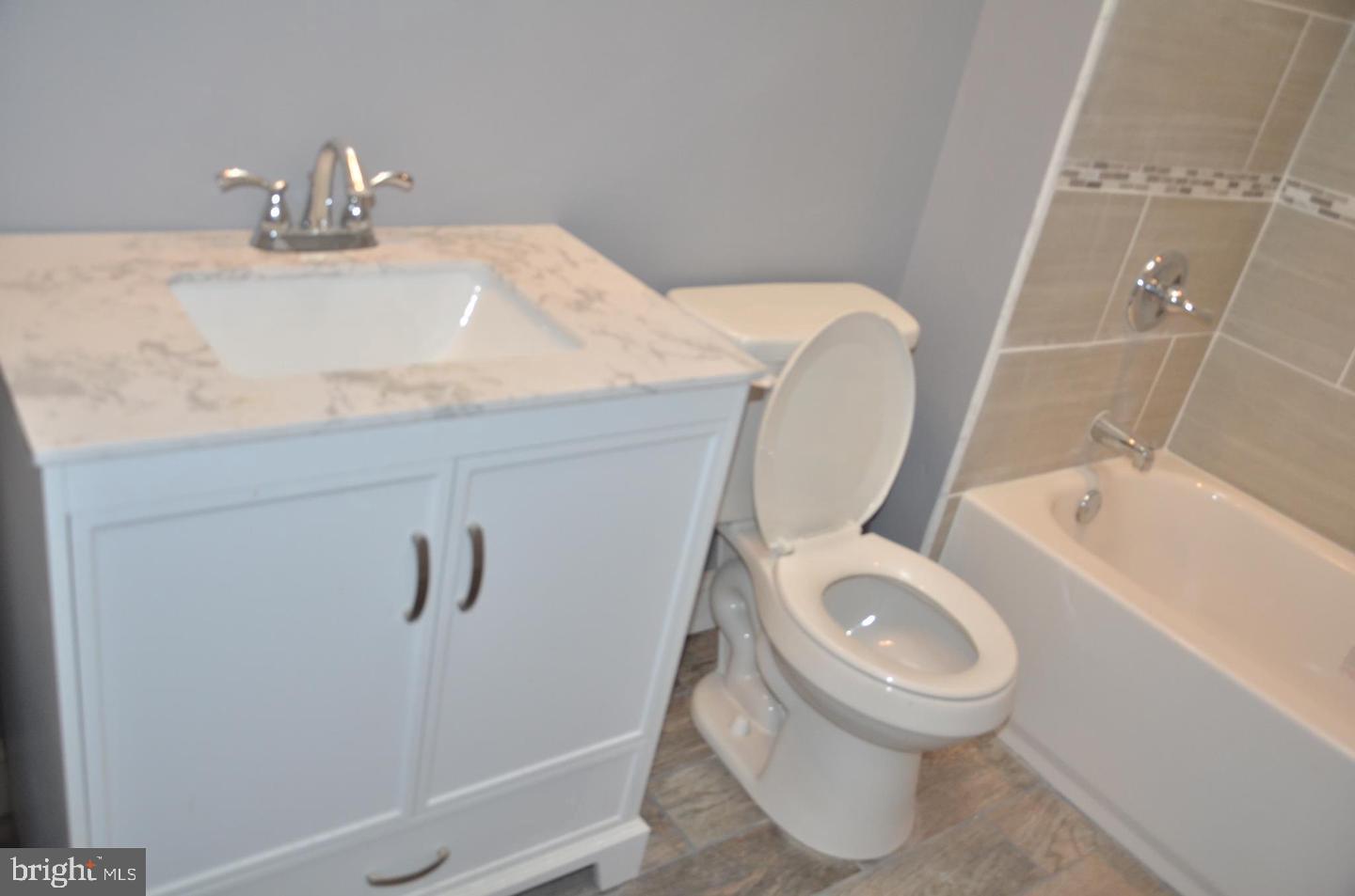 1758 South Avondale Street Philadelphia, PA 19142 - Photo 9 of 10 a bathroom with a toilet and a sink