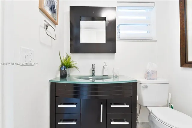 a bedroom with bed and a night stand