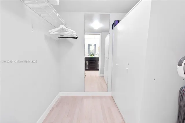 an aerial view of residential houses with outdoor space and street view