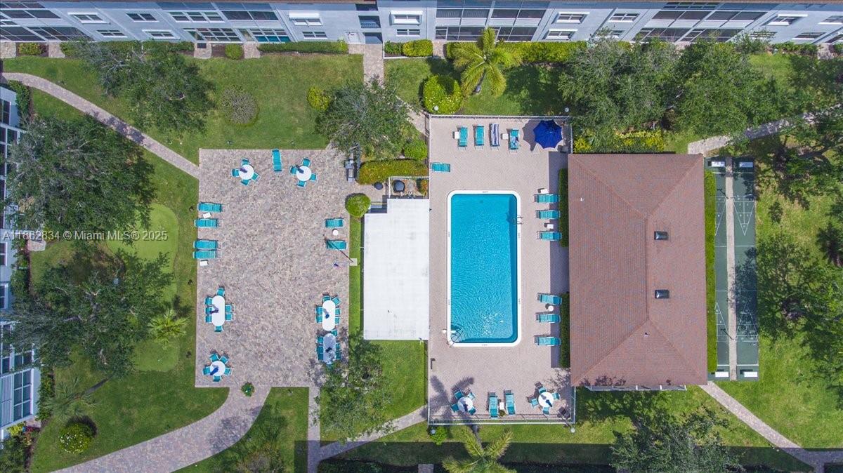 1501 South Ocean Boulevard, Unit 227 Lauderdale-by-the-Sea, FL 33062 - Photo 3 of 23 an aerial view of a house with a yard and pool