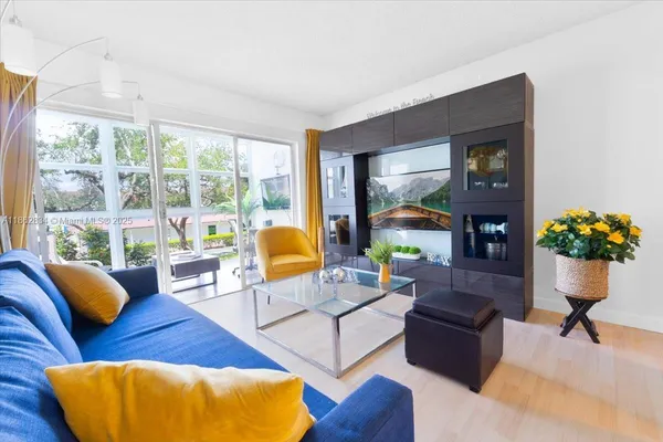 a living room with furniture and a large window
