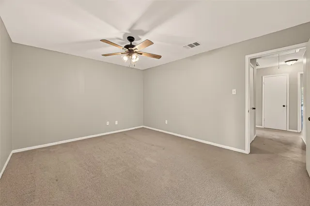 a spacious bathroom with a granite countertop sink and a mirror