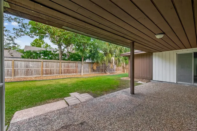 a view of a backyard with a small cabin