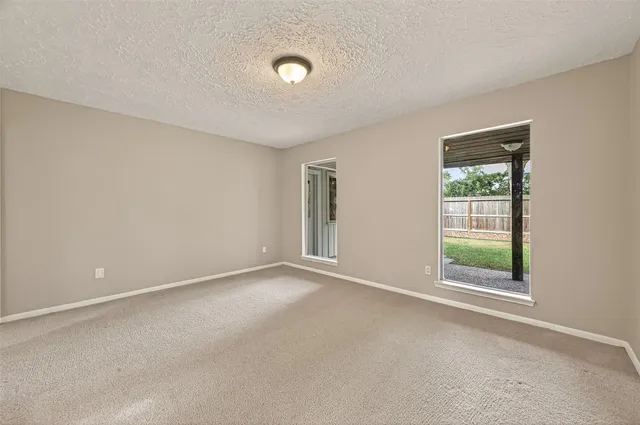 a view of an empty room with a fireplace