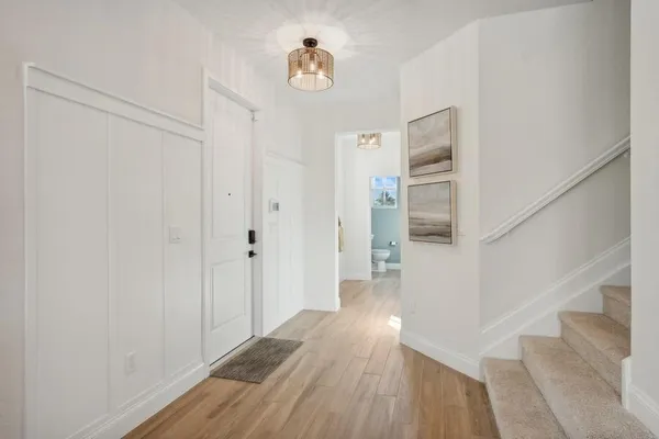 a view of entryway with wooden floor
