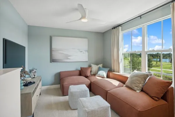 a living room with furniture and a large window