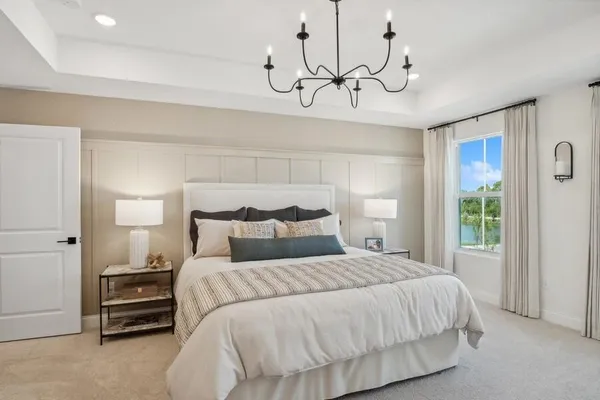a bedroom with a bed and ceiling fan