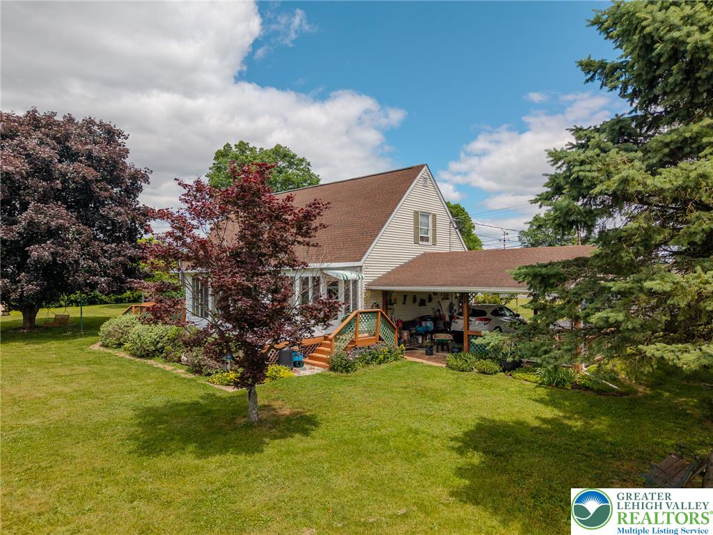 40 Locke Heights Road Bangor, PA 18013 - Photo 4 of 28 A well-maintained home with lush green landscaping and inviting outdoor spaces.