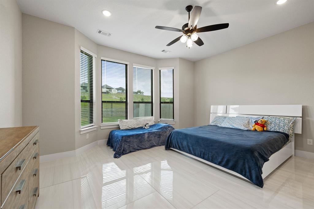 1008 Willie Rnch Way Leander, TX 78641 - Photo 19 of 40 Bedroom with recessed lighting and ceiling fan