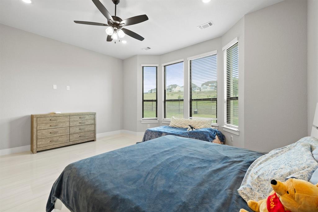 1008 Willie Rnch Way Leander, TX 78641 - Photo 20 of 40 Bedroom featuring ceiling fan and recessed lighting