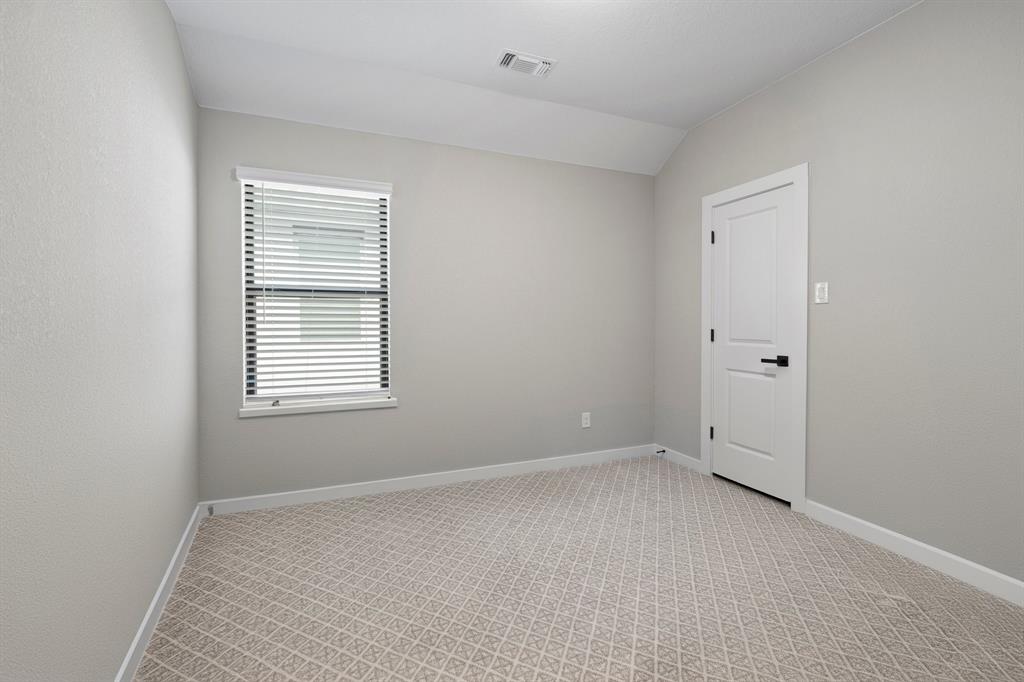 1008 Willie Rnch Way Leander, TX 78641 - Photo 24 of 40 Spare room with light colored carpet and lofted ceiling