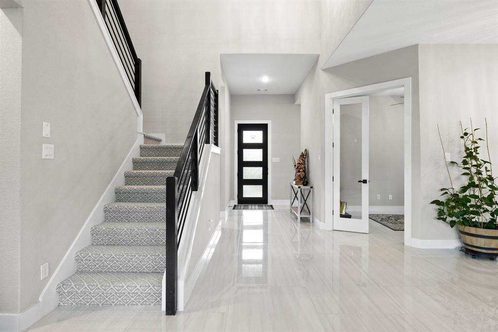 1008 Willie Rnch Way Leander, TX 78641 - Photo 4 of 40 Foyer entrance with stairway and french doors