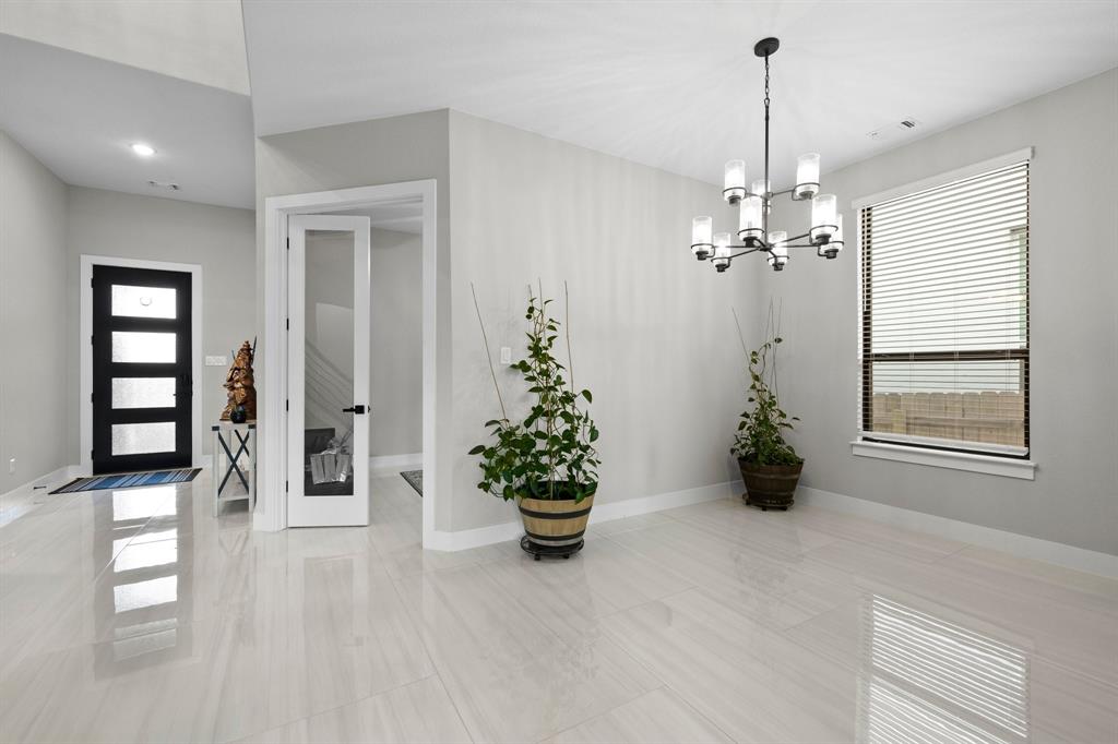 1008 Willie Rnch Way Leander, TX 78641 - Photo 5 of 40 Entrance foyer with baseboards and suspended lighting