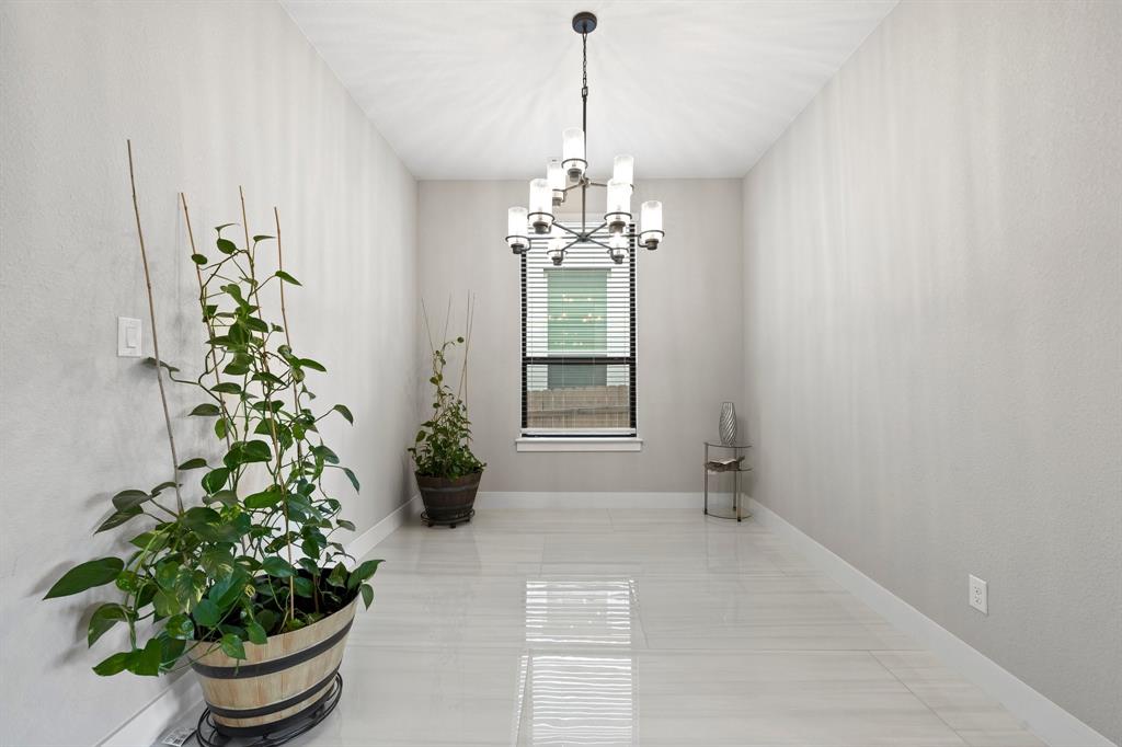 1008 Willie Rnch Way Leander, TX 78641 - Photo 7 of 40 Dining room featuring hanging lights and baseboards