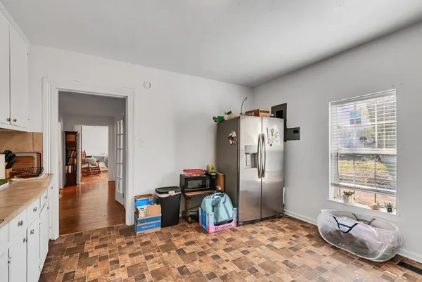 a kitchen with stainless steel appliances a stove a sink and a refrigerator