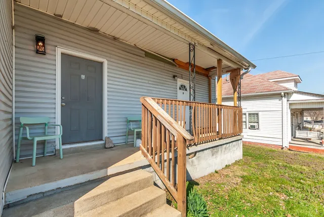 a view of house with wooden floor and a fence