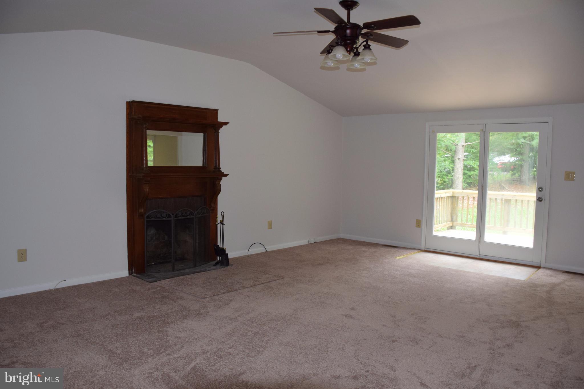 2471 Hallowing Point Road Prince Frederick, MD 20678 - Photo 3 of 30 a view of a livingroom with a ceiling fan and window