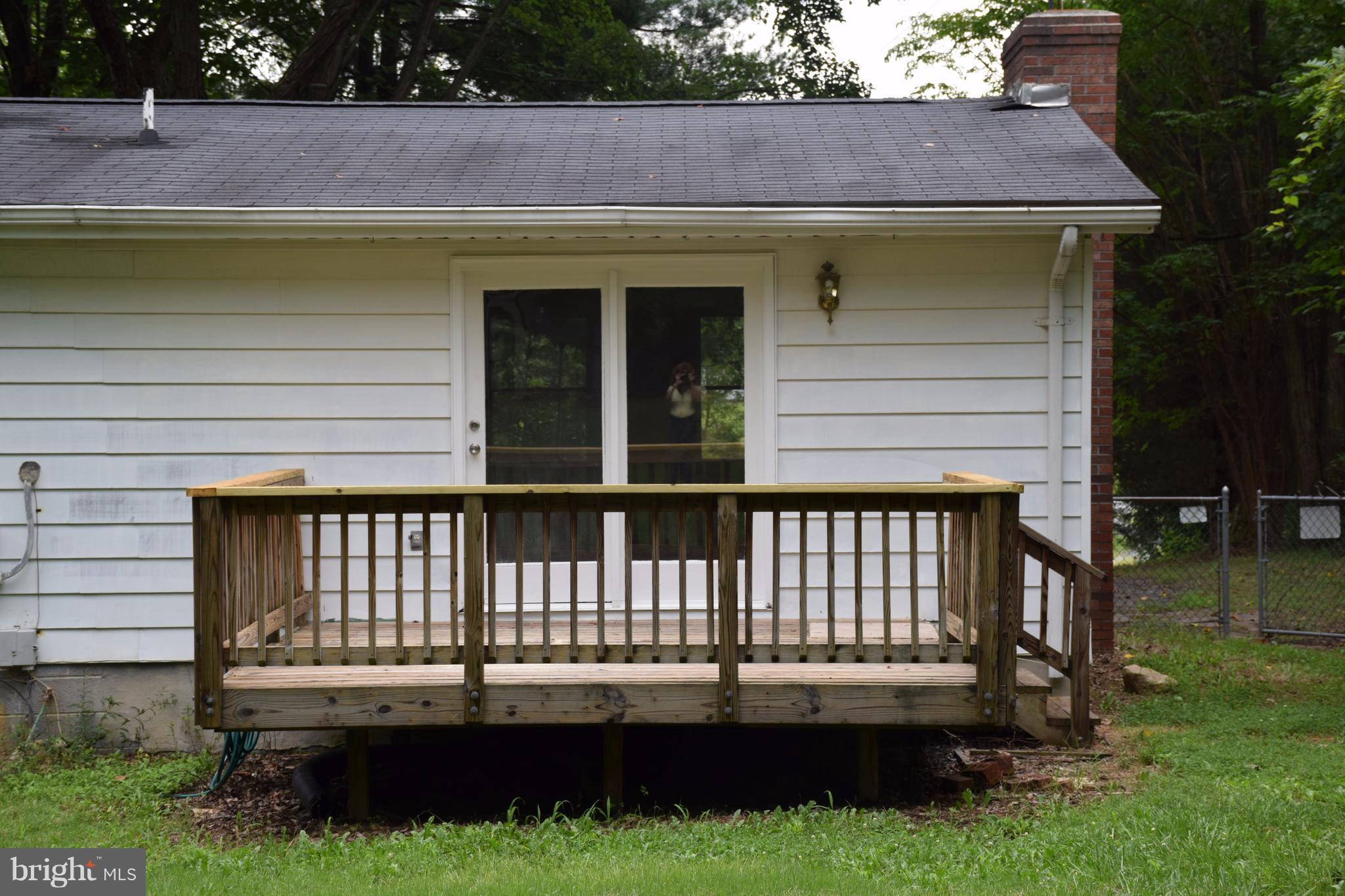 2471 Hallowing Point Road Prince Frederick, MD 20678 - Photo 29 of 30 a view of a house with a yard