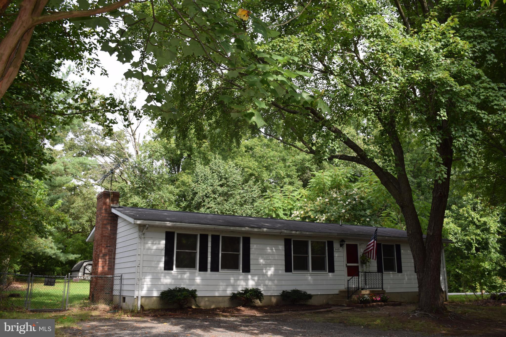2471 Hallowing Point Road Prince Frederick, MD 20678 - Photo 30 of 30 front view of a house with a tree