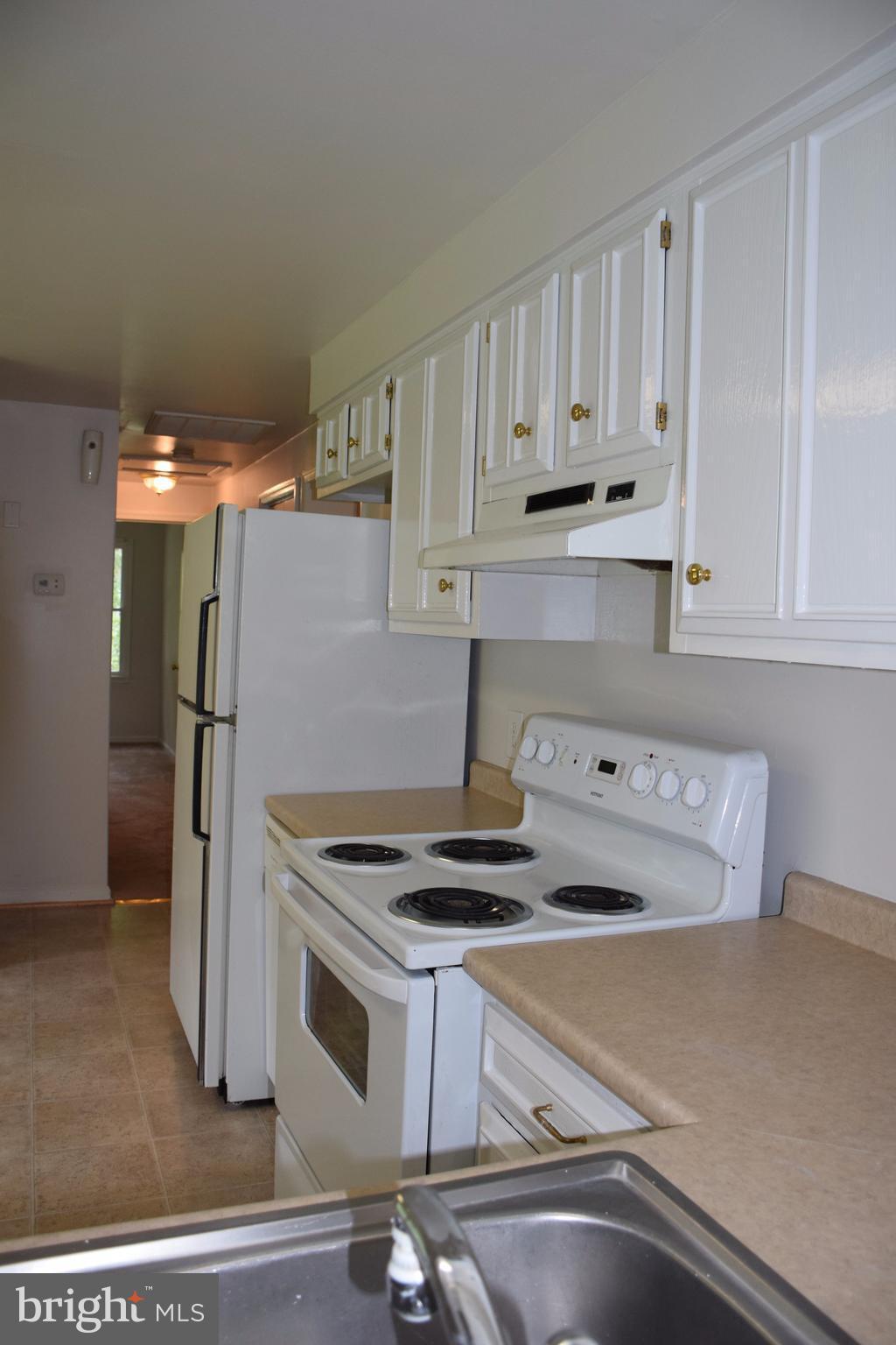 2471 Hallowing Point Road Prince Frederick, MD 20678 - Photo 10 of 30 a kitchen with stainless steel appliances granite countertop a refrigerator and a stove