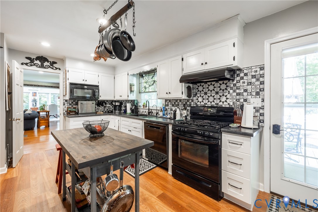 11766 Five Forks Road Farmville, VA 23901 - Photo 18 of 50 a kitchen with stainless steel appliances granite countertop a stove and a sink