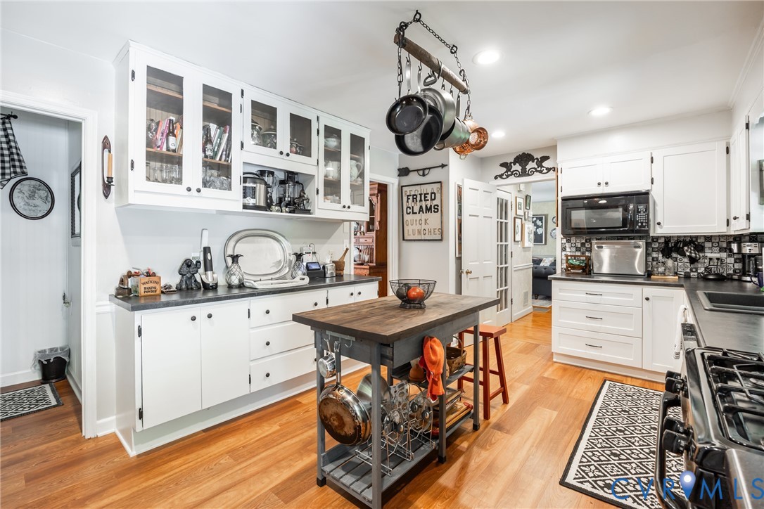 11766 Five Forks Road Farmville, VA 23901 - Photo 19 of 50 a kitchen with stainless steel appliances granite countertop a stove a sink and a refrigerator