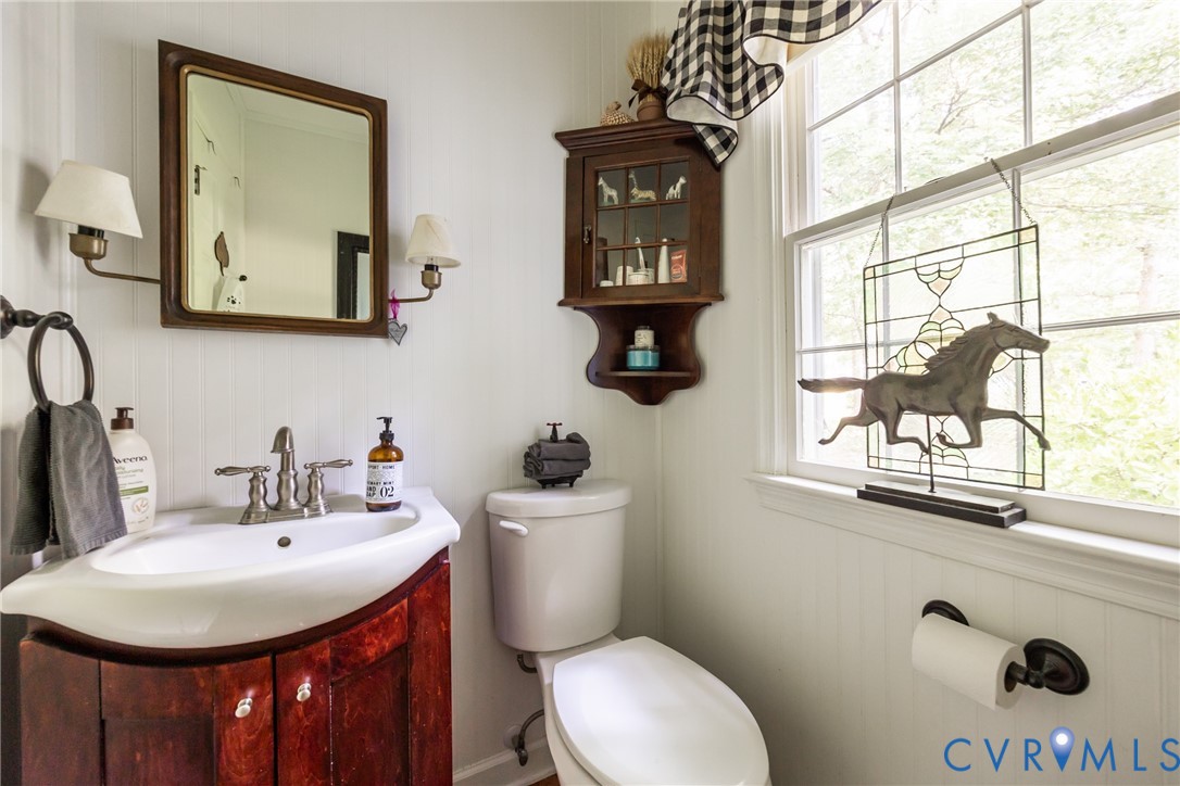 11766 Five Forks Road Farmville, VA 23901 - Photo 20 of 50 a bathroom with a toilet a sink and mirror