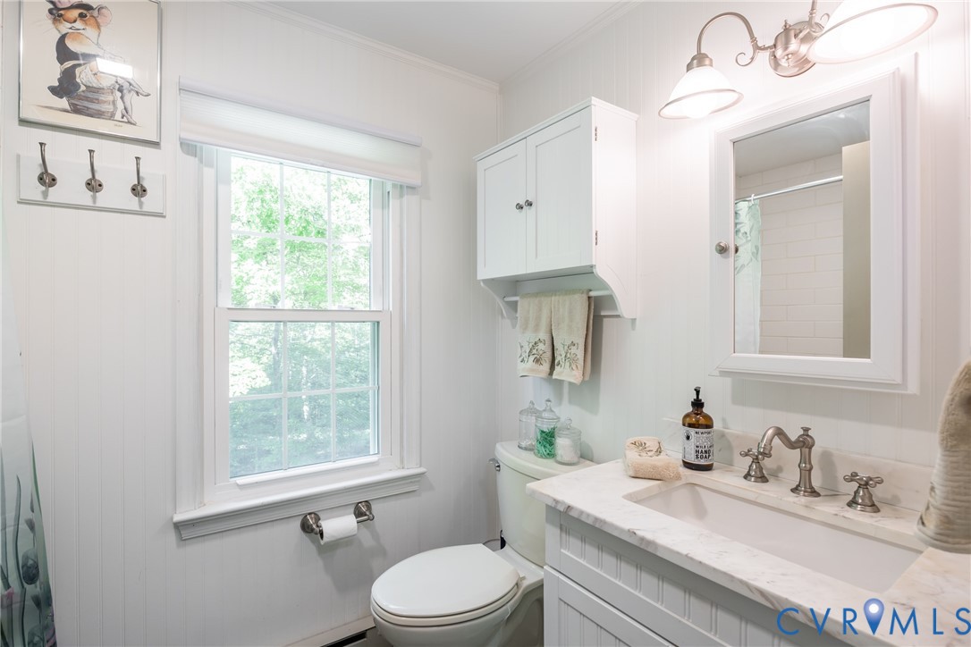 11766 Five Forks Road Farmville, VA 23901 - Photo 24 of 50 a bathroom with a granite countertop sink mirror vanity and toilet