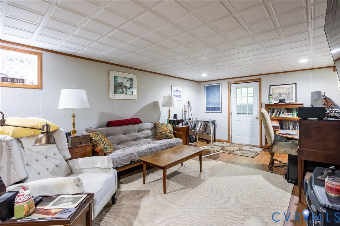 11766 Five Forks Road Farmville, VA 23901 - Photo 30 of 50 a living room with furniture a wooden floor and a window