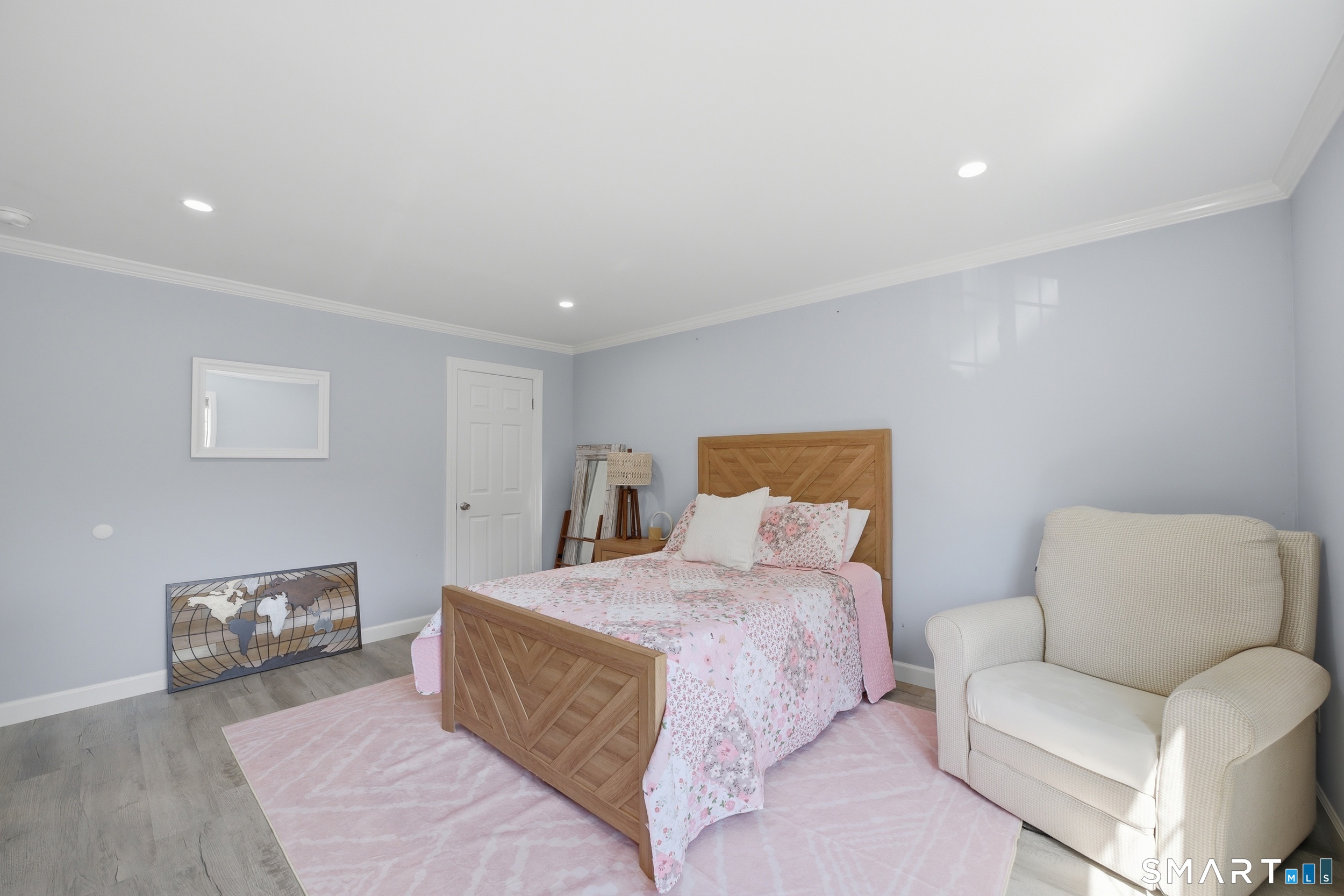 187 Flax Hill Road, Unit D1 Norwalk, CT 06854 - Photo 21 of 32 a bedroom with a bed and a couch
