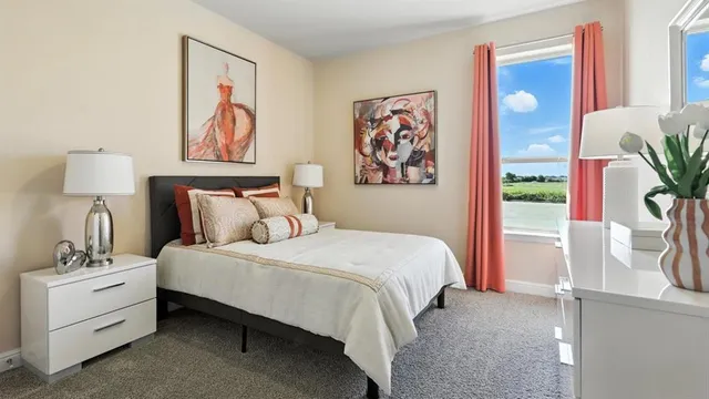 a bedroom with a bed and a mirror