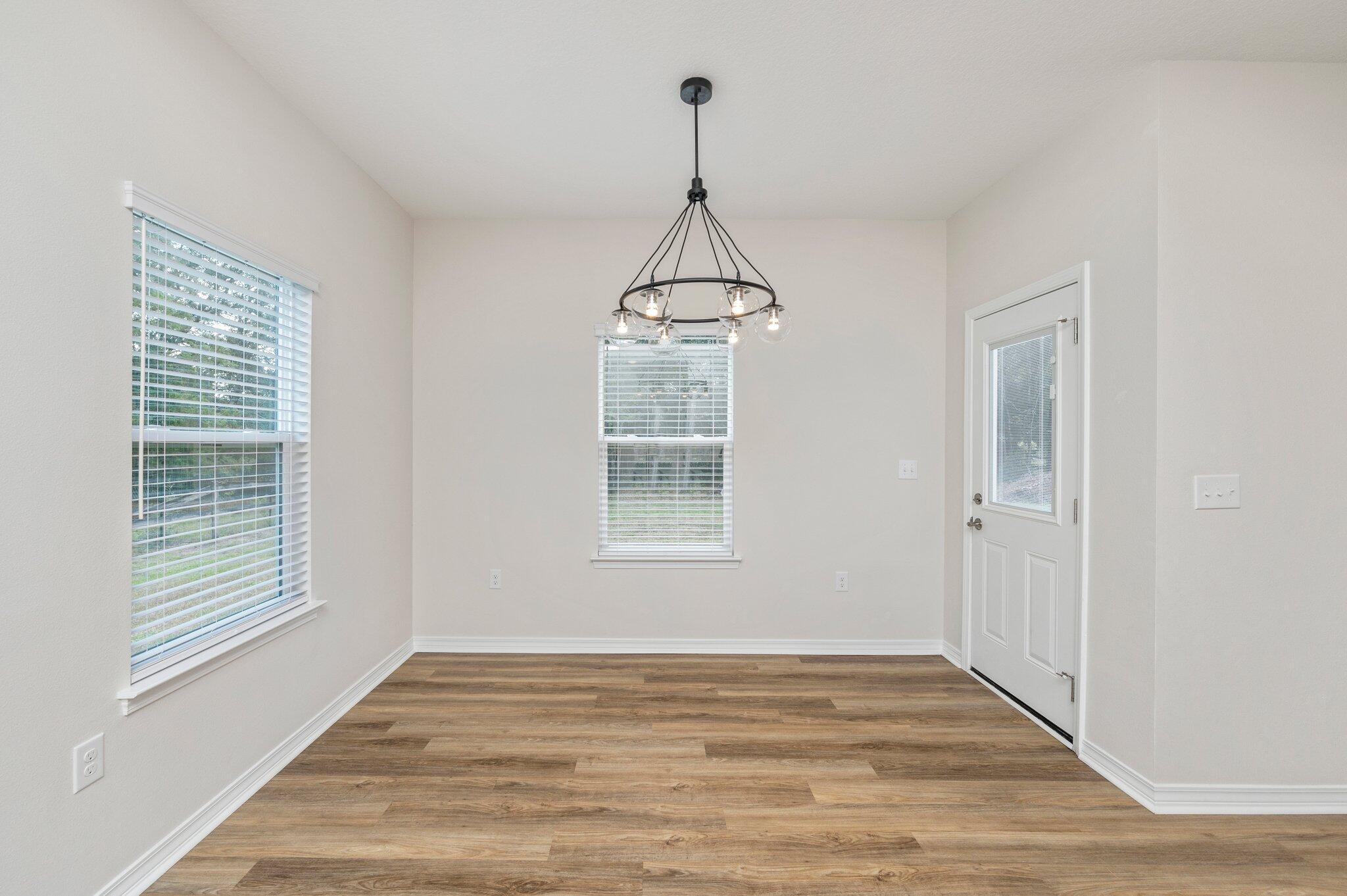 3156 Forrest Avenue Crestview, FL 32539 - Photo 17 of 44 a view of empty room with wooden floor and fan
