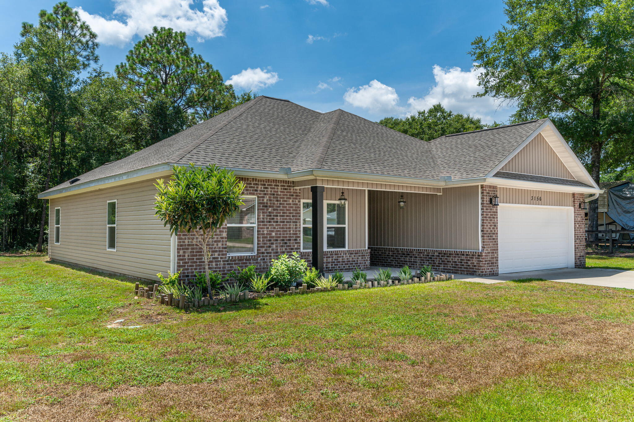 3156 Forrest Avenue Crestview, FL 32539 - Photo 2 of 44 a front view of house with yard and green space